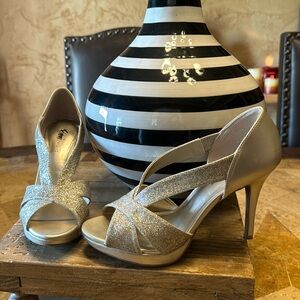 Gold glitter strap heels with a 4 inch heel.